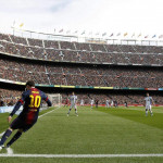 General view of Camp Nou stadium as Barcelona’s Lionel Messi shoots a corner during their Spanish First division soccer league match against Getafe, in Barcelona